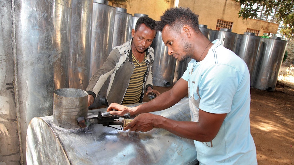 Youth artisans (SMEs) fabricating metal silos in Debub Achefer, Amhara Region, Ethiopia