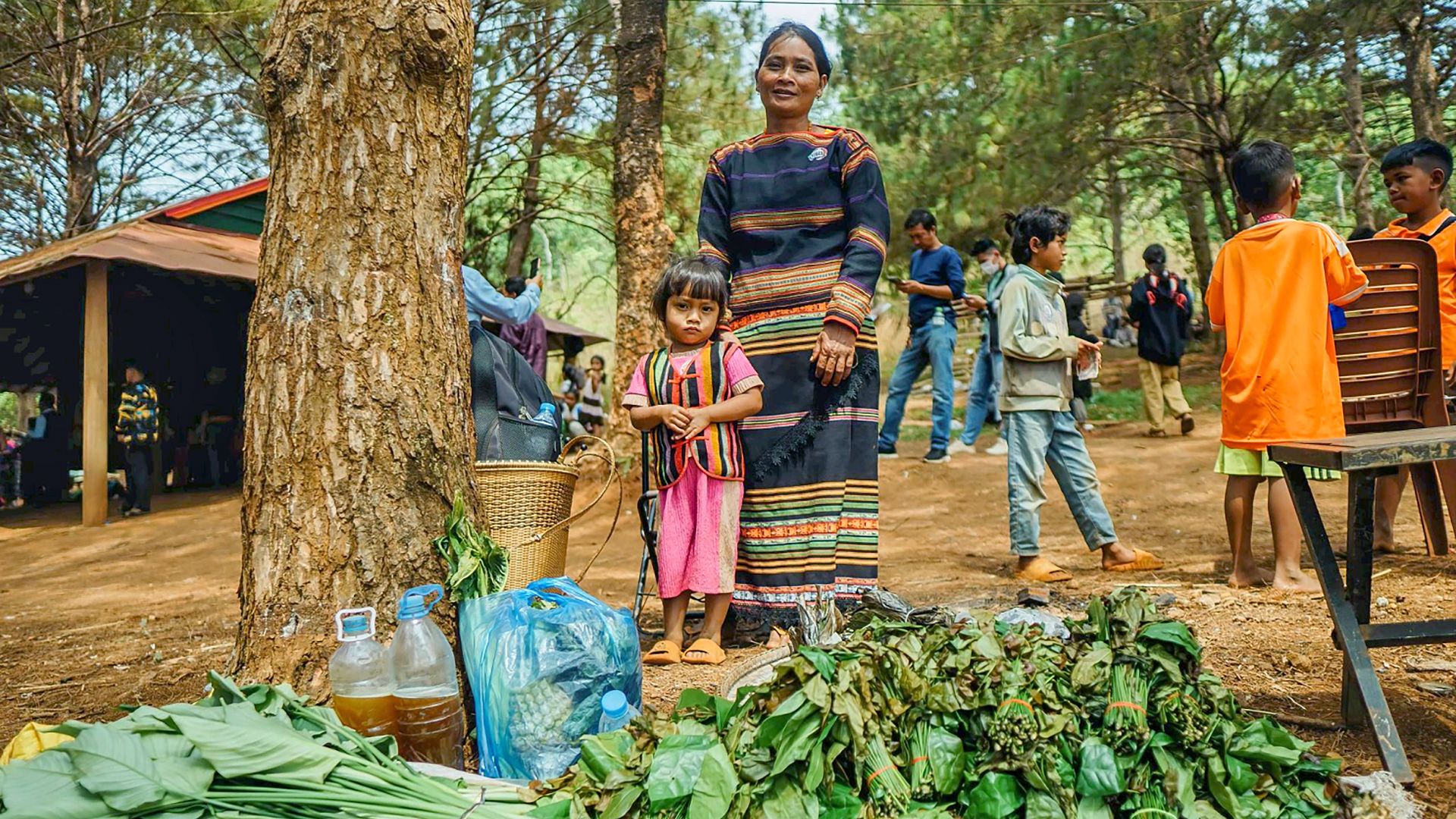 A mother and daughter in Cambodia, together with their indigenous vegetables.